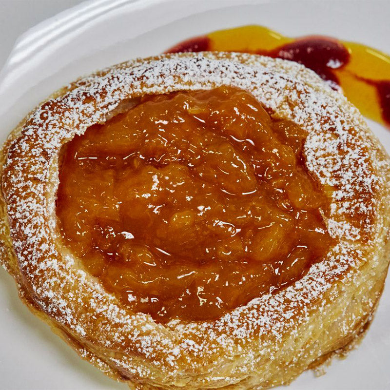 Round homemade danish with fresh apricot filling.
