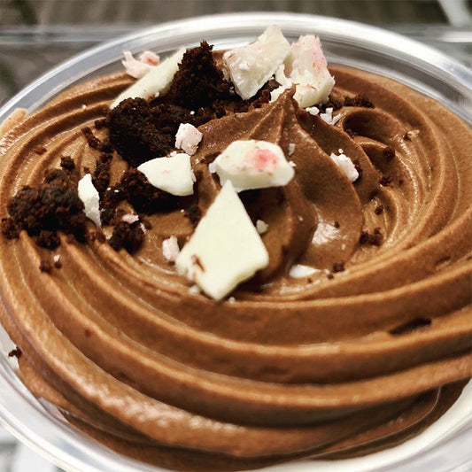 Glass bowl with chocolate mousse, layered with white chocolate mousse.