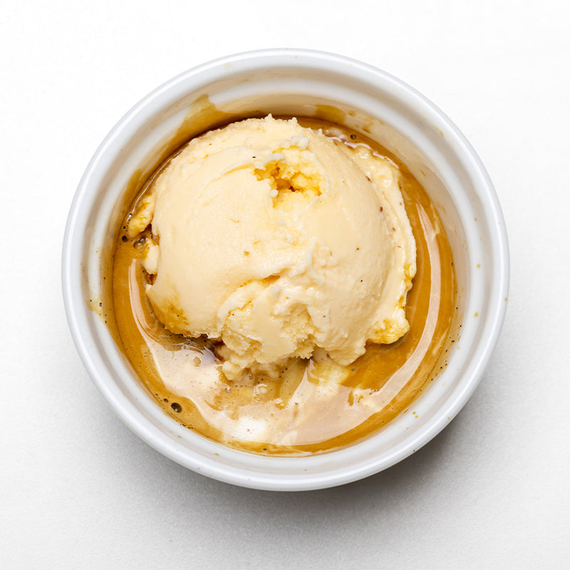 Vanilla ice cream on top of a shot of espresso, topped with chocolate shavings.