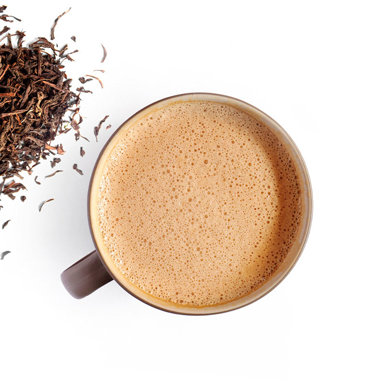 Mug filled with hot chai latte.