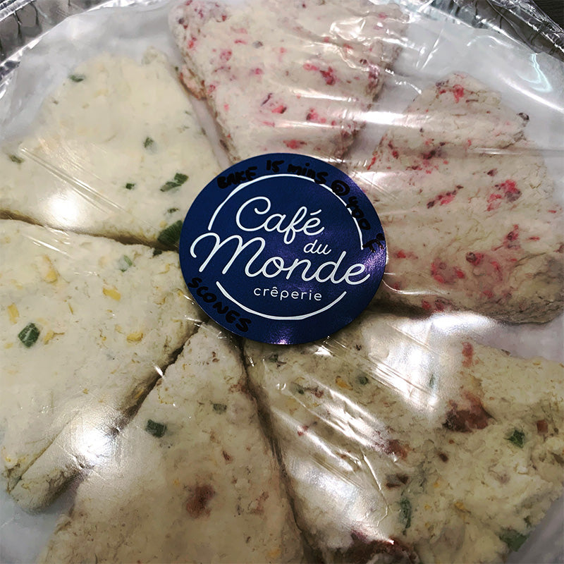 Six frozen scones in a circle wrapped in plastic.