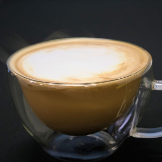 Mug of hot espresso and steamed milk.